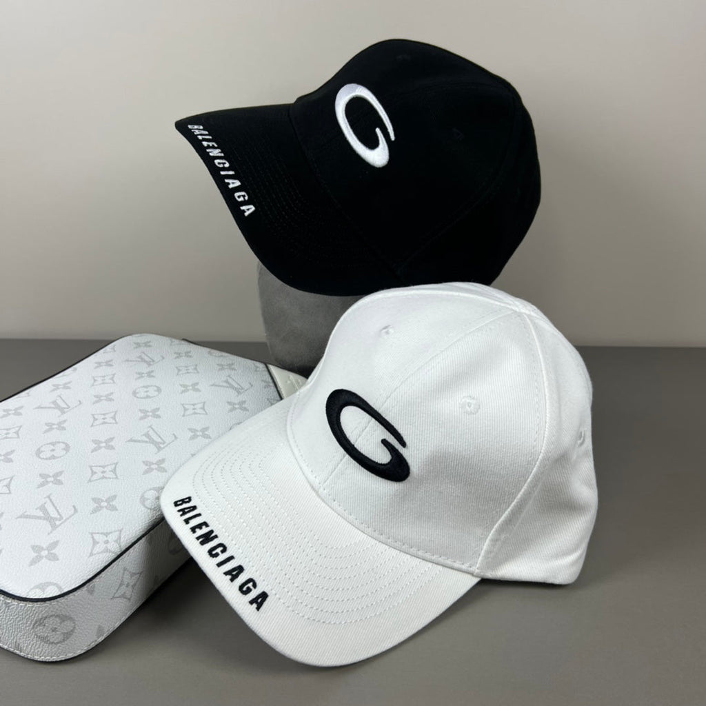 Black cotton cap with white oval emblem embroidery
